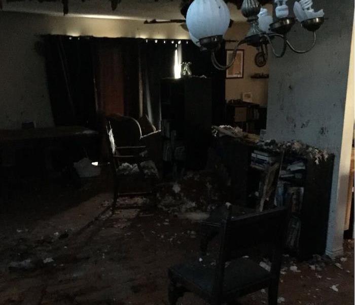 Room with fire damage and heavy smoke damage