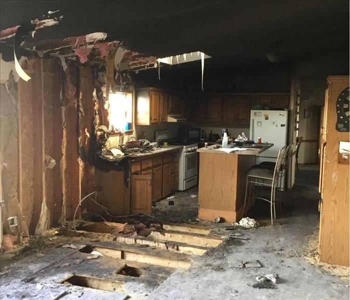 burned kitchen, hole in roof