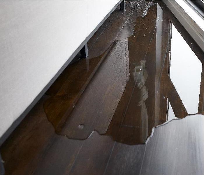Water leaking and flooded on wood parquet floor