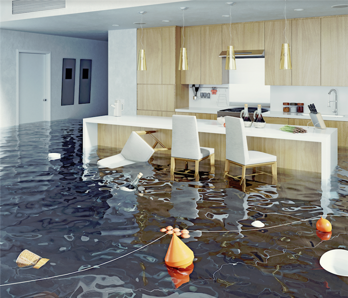 a flooded kitchen with chairs floating