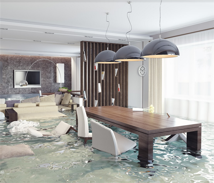 a flooded apartment with water covering the floor and furniture everywhere