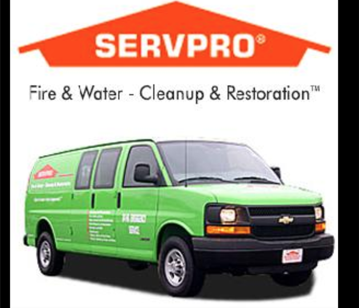 A green SERVPRO van on a white background. 
